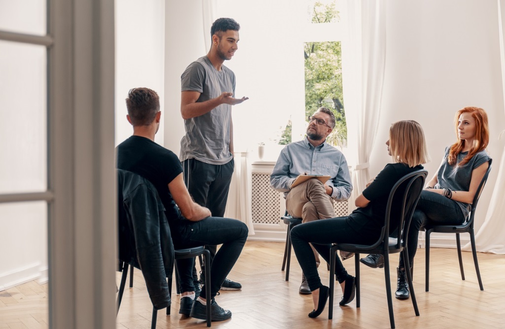 Young man speaking in a co-occurring therapy session